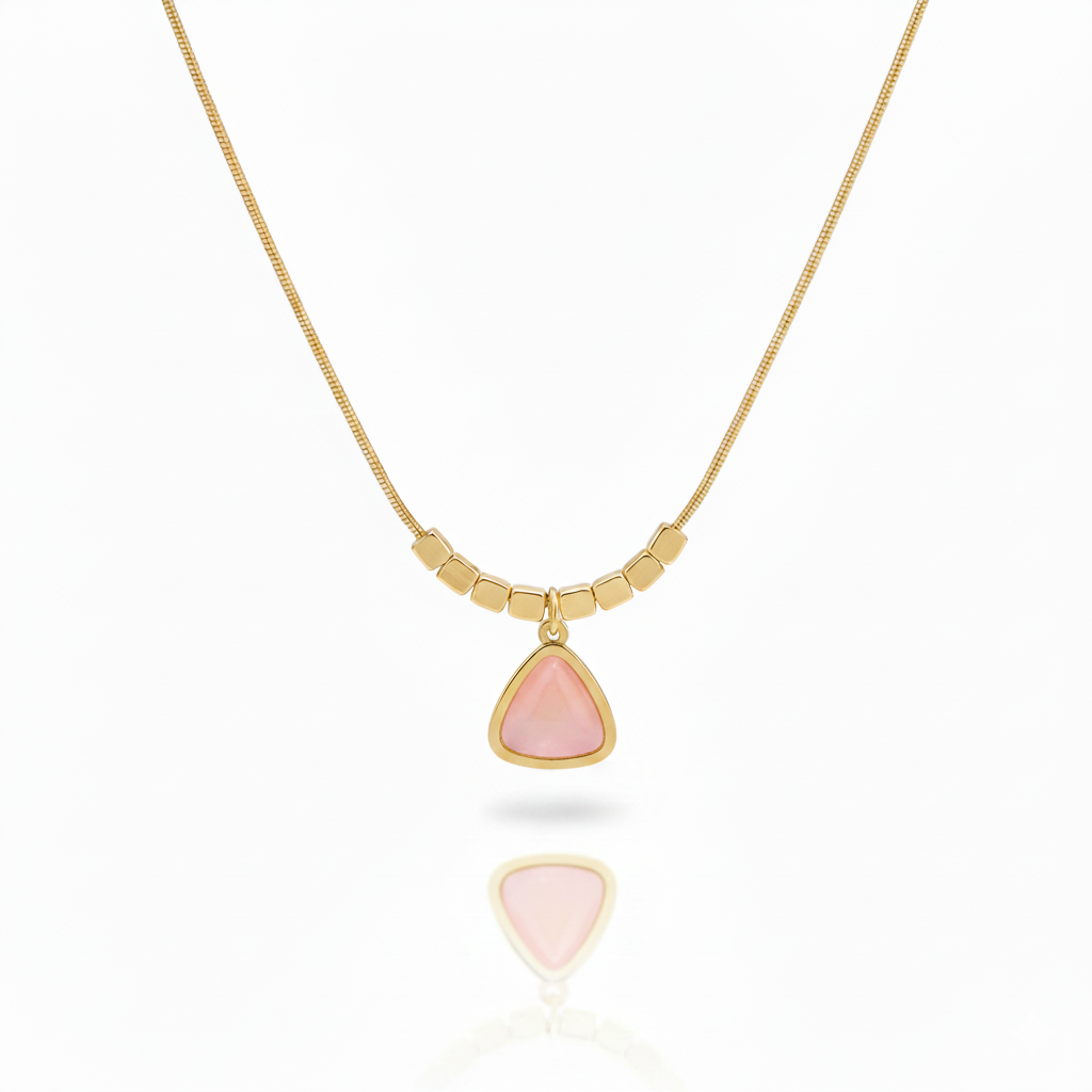 Minimalist gold plated snake chain necklace featuring a smooth triangular gemstone pendant and decorative square beads. Available in Green, Pink, and White. Modern daily wear jewellery for women. Minimalist Necklace, Gold Plated Necklace, Geometric Jewellery, Triangle Pendant, Snake Chain Necklace, Daily Wear Jewellery, Office Wear Necklace, Stone Pendant, Modern Necklace, Vrumaira, Surat Jewellery, Green Stone Necklace, Pink Stone Necklace, White Stone Necklace, Rose Quartz Look, Jade Look, Opal Look